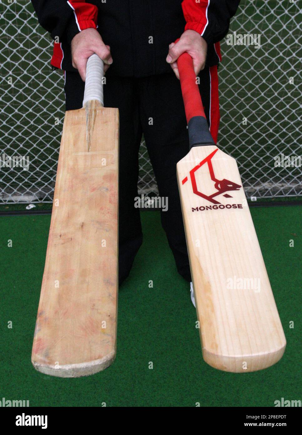 The new Mongoose bat, right, is held next to a traditional bat at Lord's  cricket ground, London, Wednesday May 22, 2009. The Mongoose cricket bat  which is 33 per cent smaller than