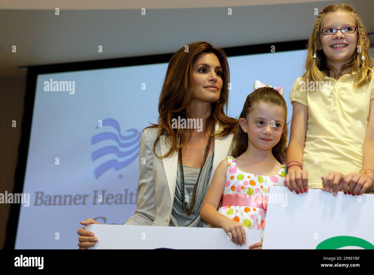 Cindy Crawford, left, joins former patients Sydney Sherman, and Alexis