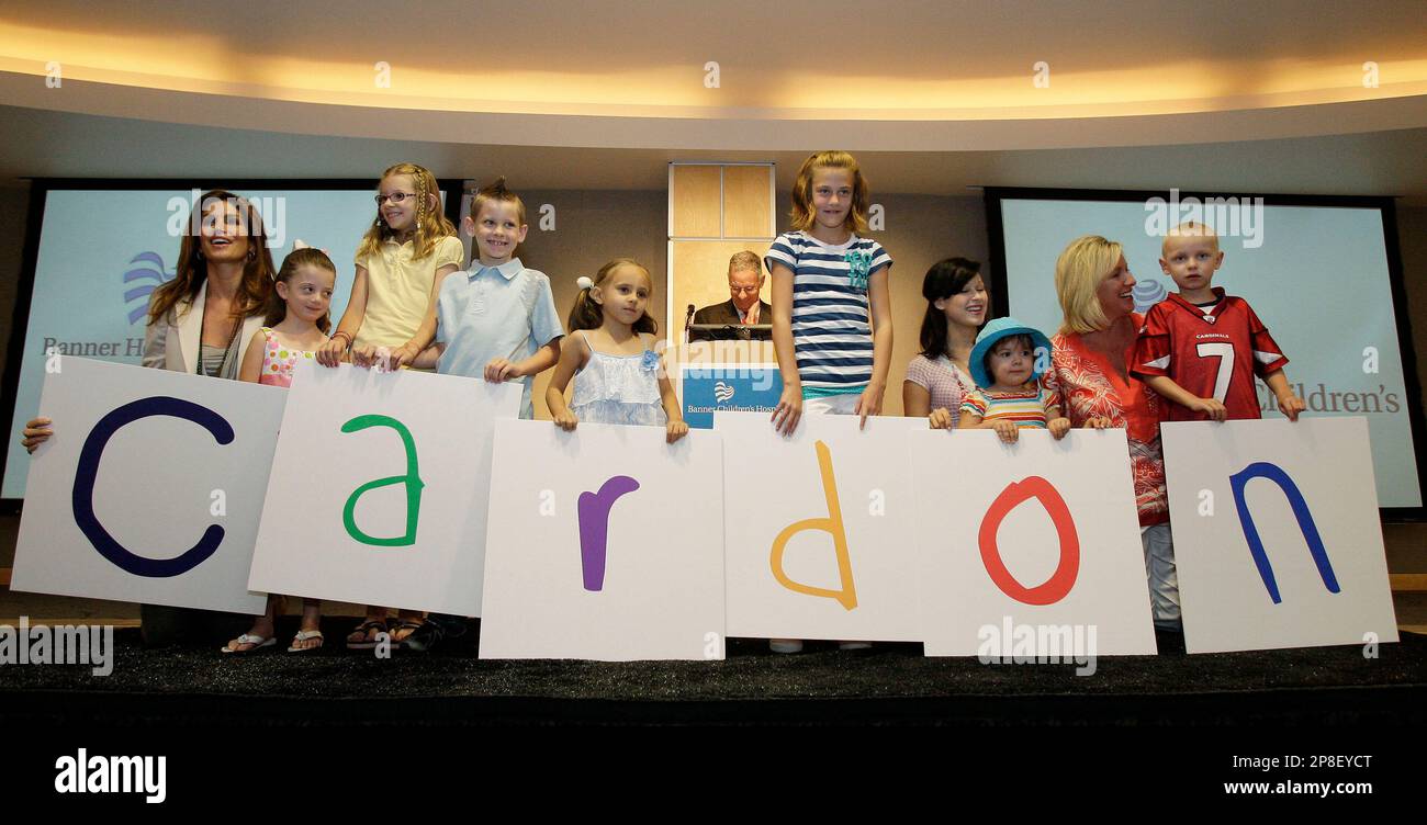 Cindy Crawford, far left, helps spell out Cardon with former patients