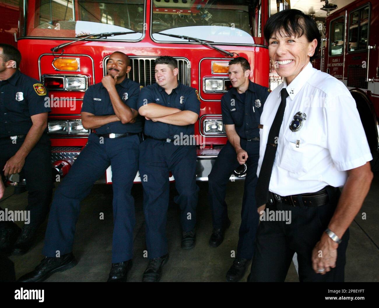 Los Angeles Fire Department Capt. Tina Haro, right with fellow firefighters  are seen after a news conference held by Mayor Antonio Villaraigosa at Fire  Station number three, Wednesday, May 20, 2009 in