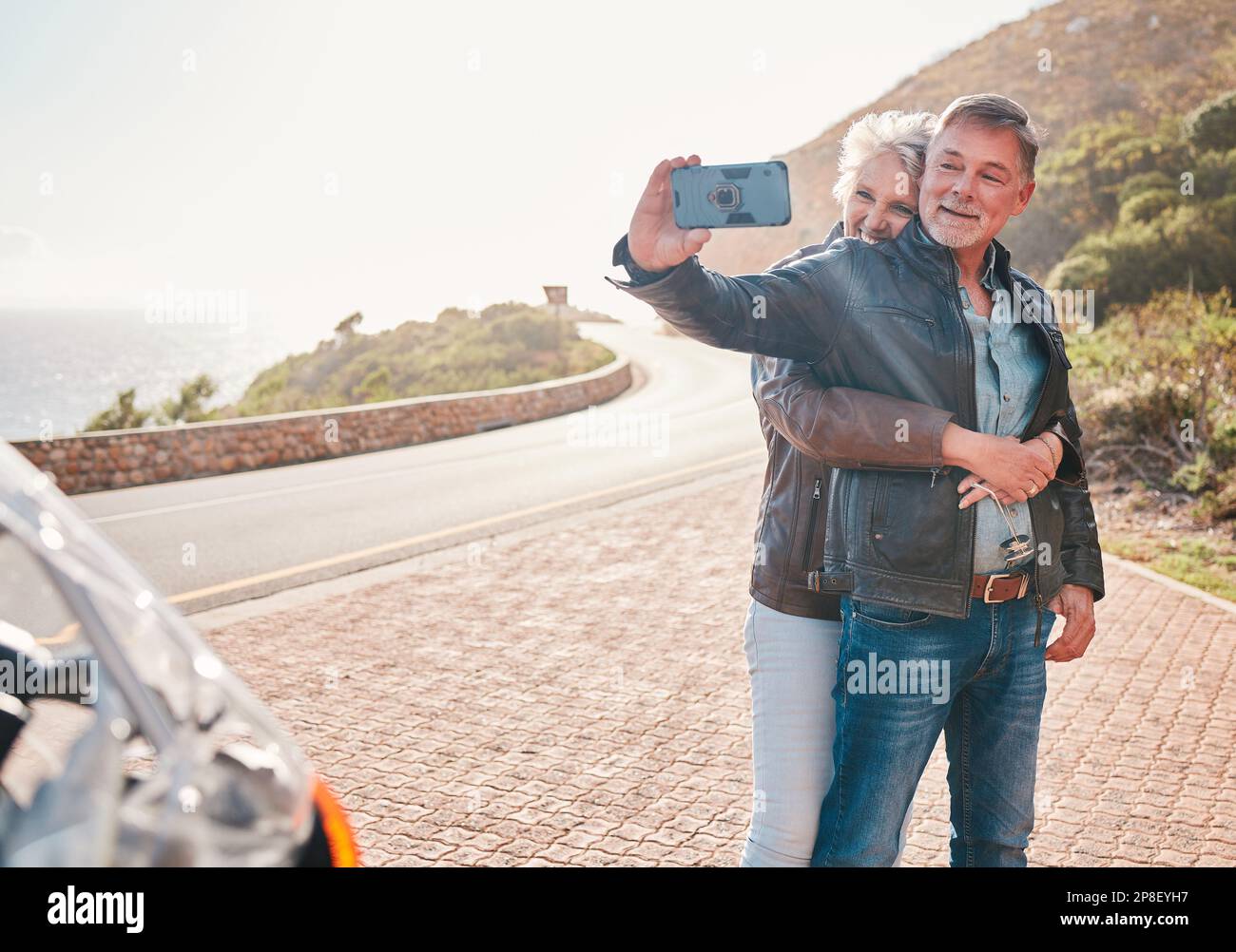 Mountain, bikers and couple taking a selfie together while on an adventure, vacation or weekend trip. Freedom, nature and senior man and woman in Stock Photo