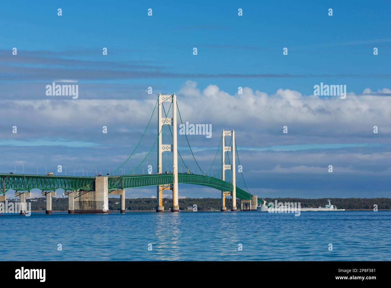 A long suspension bridge with a ship. Stock Photo