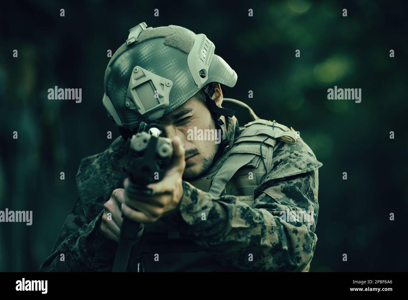 A modern warfare soldier on war duty in dense and dangerous forest ...