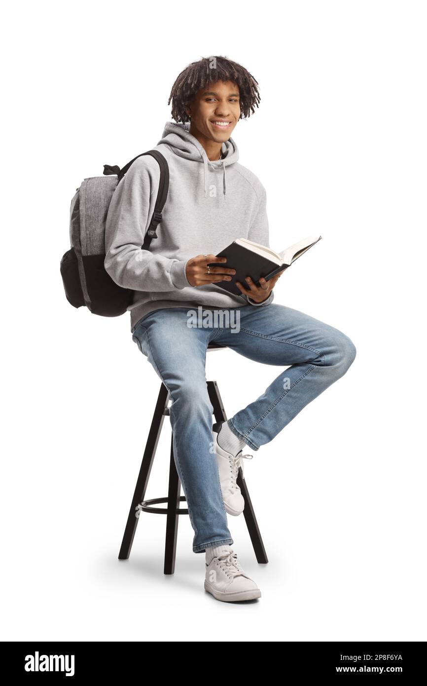 African american male student with a backpack sitting on a chair and ...