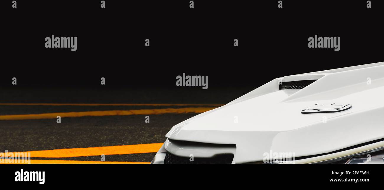 Close up of a air duct on car hood of turbo engine in a white sports car, panoramic banner with copy space Stock Photo