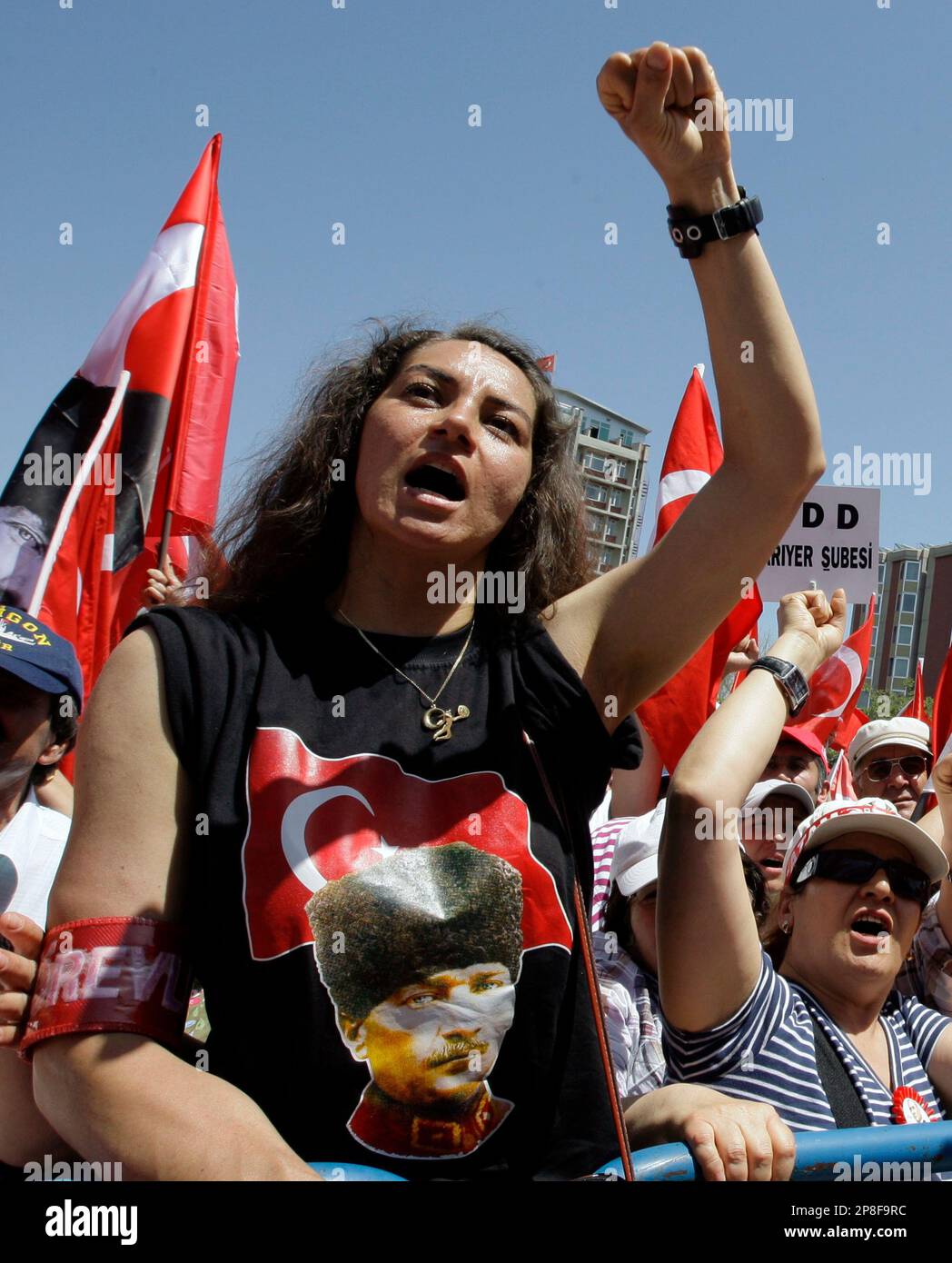 Tens of thousands of people shout anti-government slogans as they ...