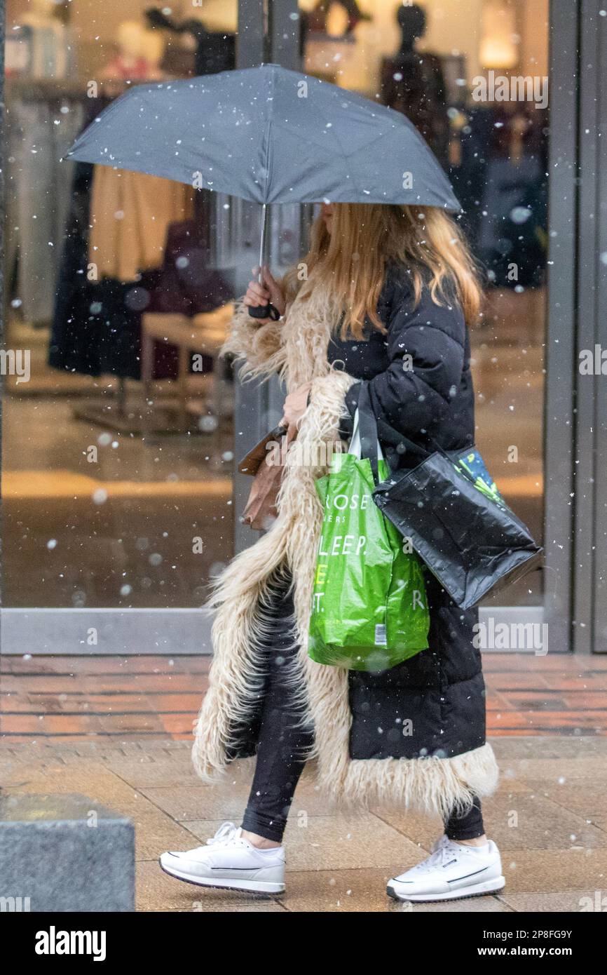 Preston, Lancashire.  UK Weather, 9 Mar 2023.  Shops, shoppers on a winter's day in the city centre. A day of snow and sleet showers in the city centre. The forecast is for cloudy skies and further spells of sleet and snow pushing in from the west, these becoming heavy at times. Credit; MediaWorldImages/AlamyLiveNews Stock Photo