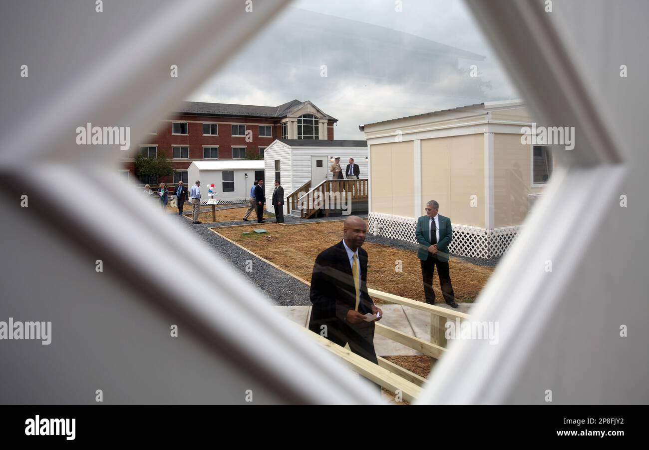 Media and officials tour the six newly designed mobile homes at the
