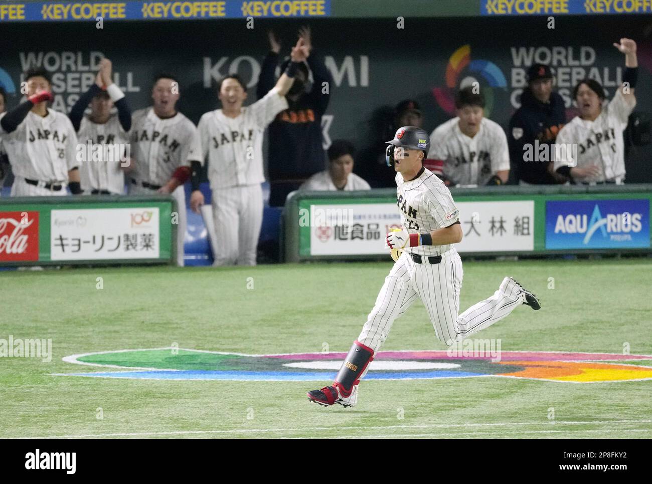 Lars Nootbaar of Japan runs to the first base after hitting a