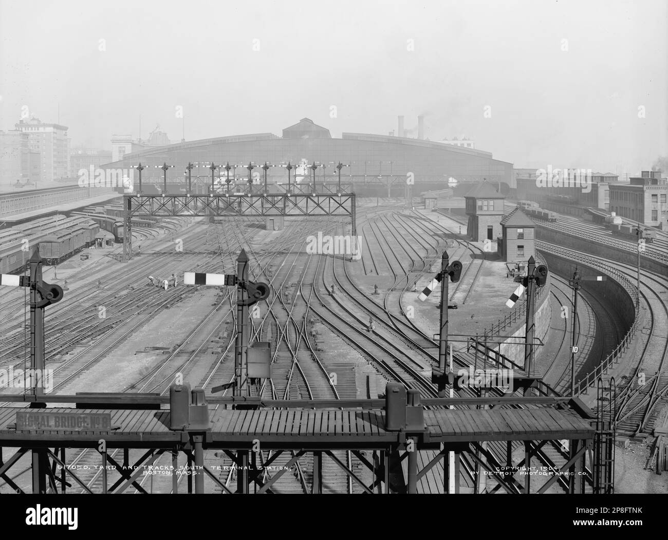 'English:  Approach tracks and trainshed of South Station in Boston, Massachusetts in 1904. The tracks leading to the unused underground platform are at right.; circa 1904 date QS:P,+1904-00-00T00:00:00Z/9,P1480,Q5727902; This file was derived from: Yard and tracks, South Terminal Station, Boston, Mass.jpg:         This image  is available from the United States Library of Congress's Prints and Photographs division under the digital ID det.4a11367.This tag does not indicate the copyright status of the attached work. A normal copyright tag is still required. See Commons:Licensing for more infor Stock Photo