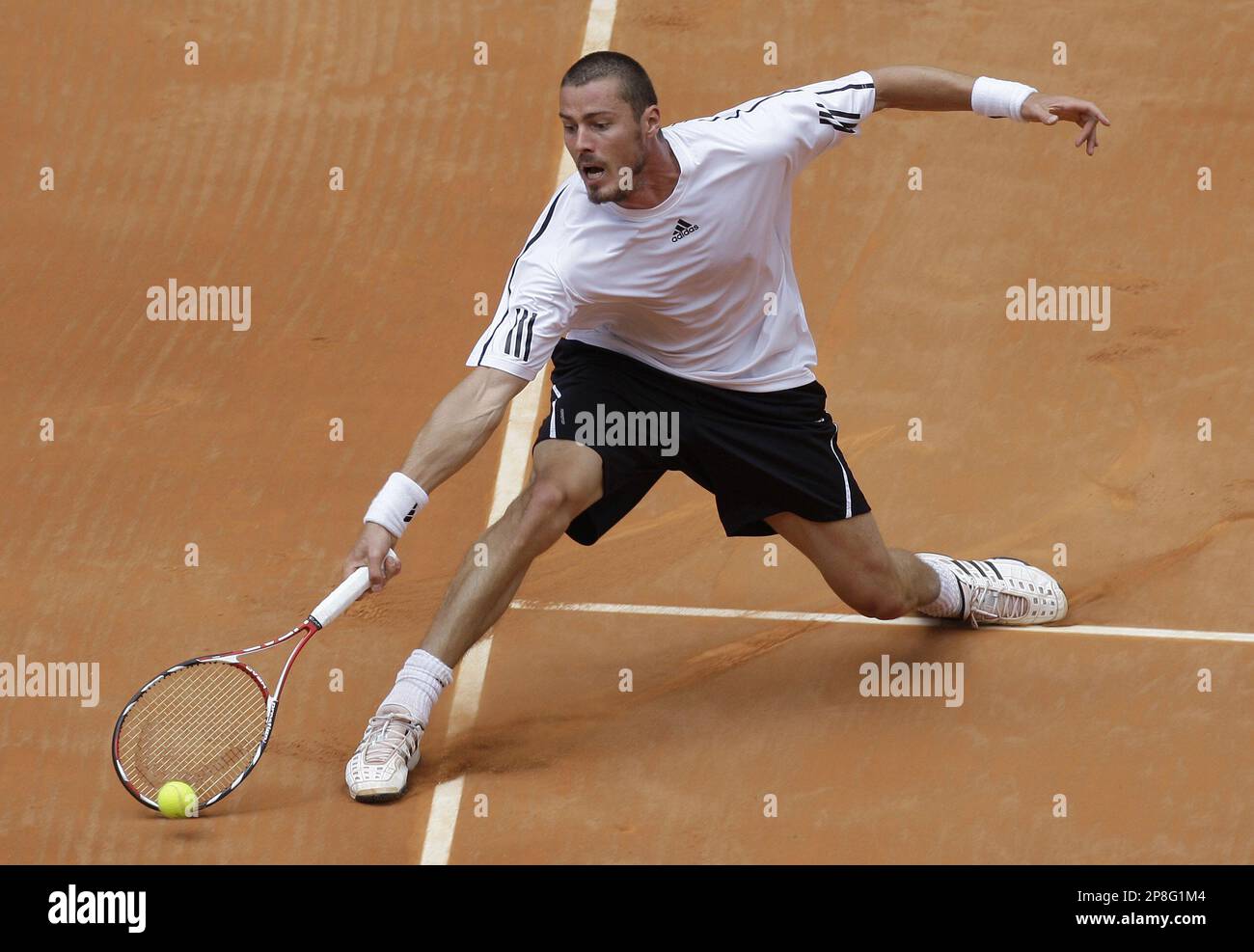 Marat Safin of Russia returns a shot during his match against Jo-Wilfred  Tsonga of France at the Madrid Open Tennis Tournament at the Caja Magica  (Magic Box) in Madrid, Monday May 11,