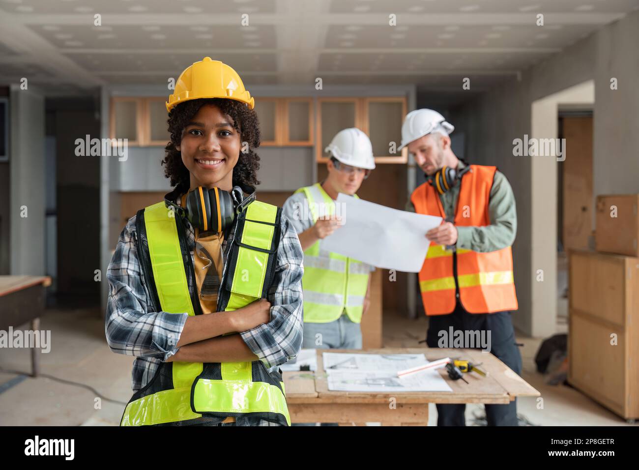 portrait female engineer project manager with construction gear and