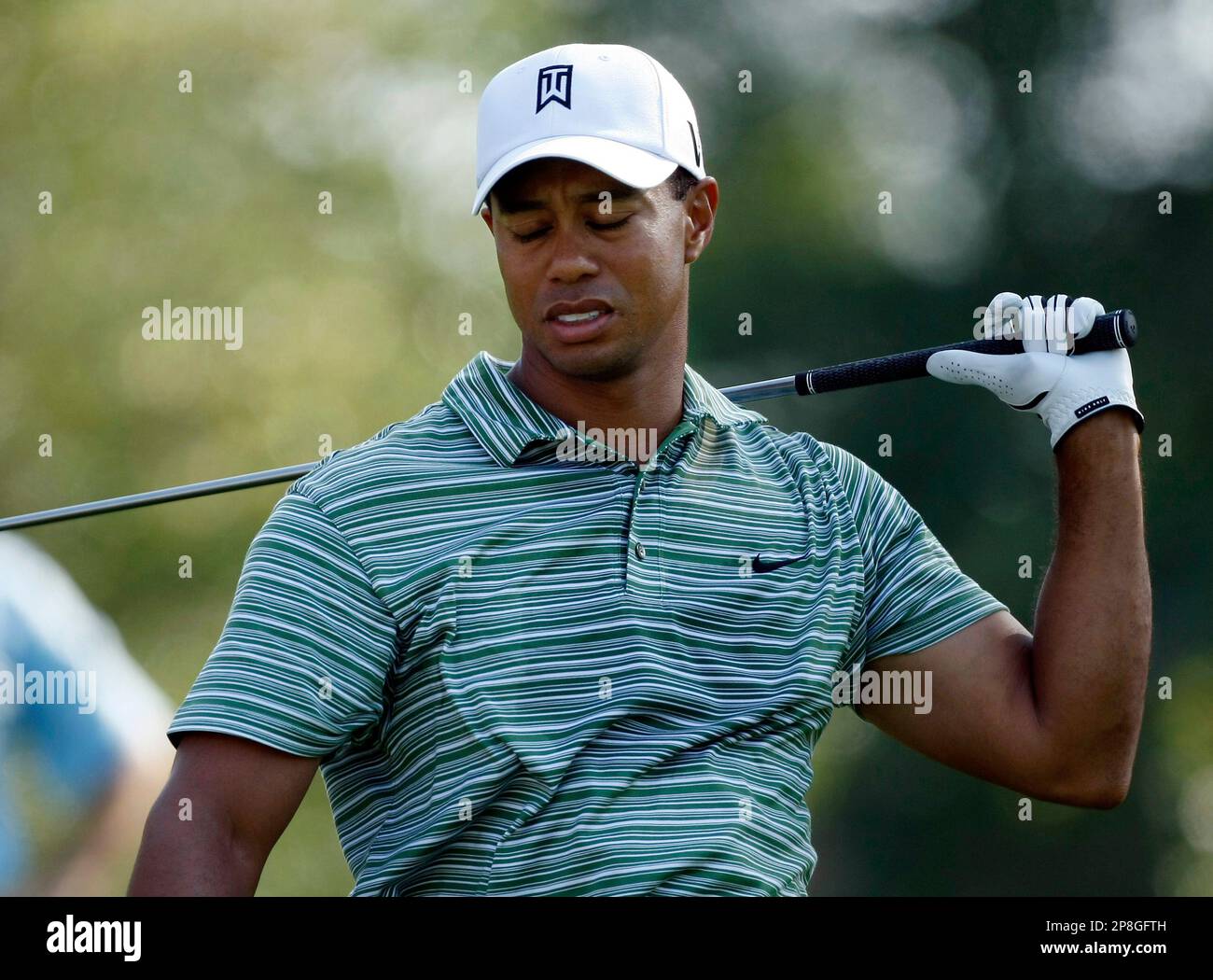 Tiger Woods reacts to an errant tee shot on the 14th hole during the ...