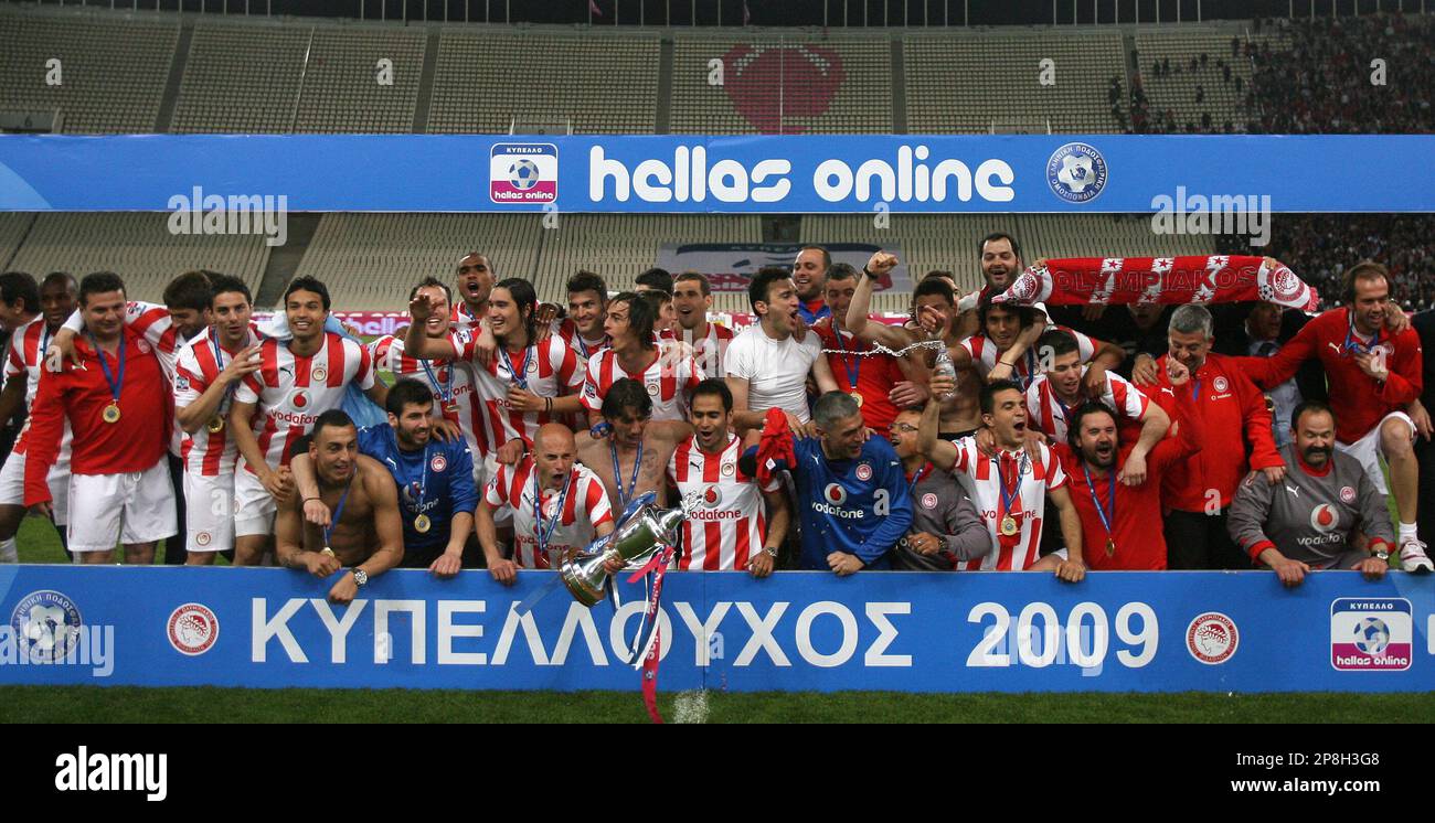 Olympiakos' players celebrate after the Greek Cup Final soccer match at the  Olympic stadium of Athens, on Saturday, May 2, 2009. Goalkeeper Antonis  Nikopolidis saved a penalty and then scored the final