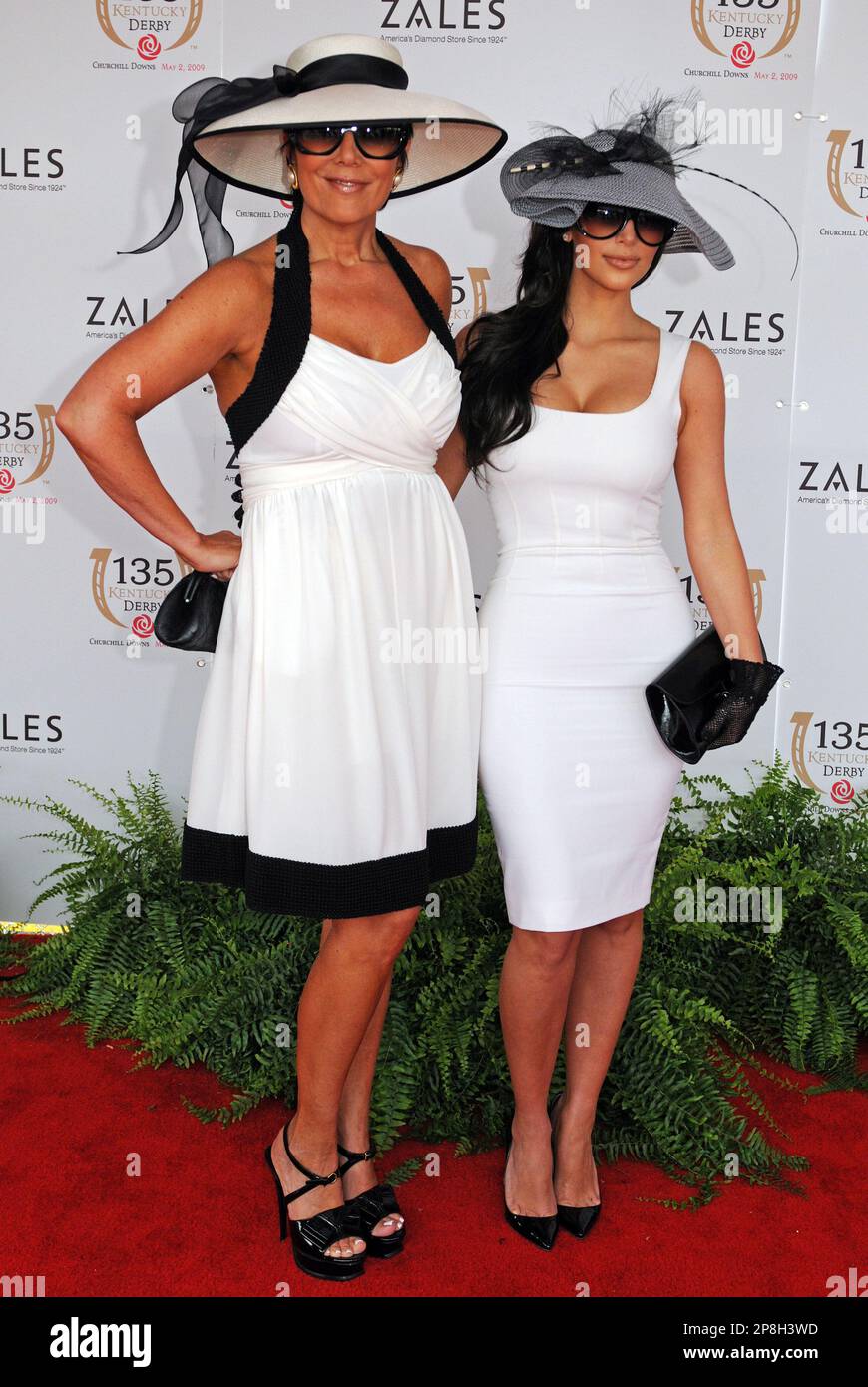Kim Kardashian, right, poses with her mother Kris Jenner as they arrive