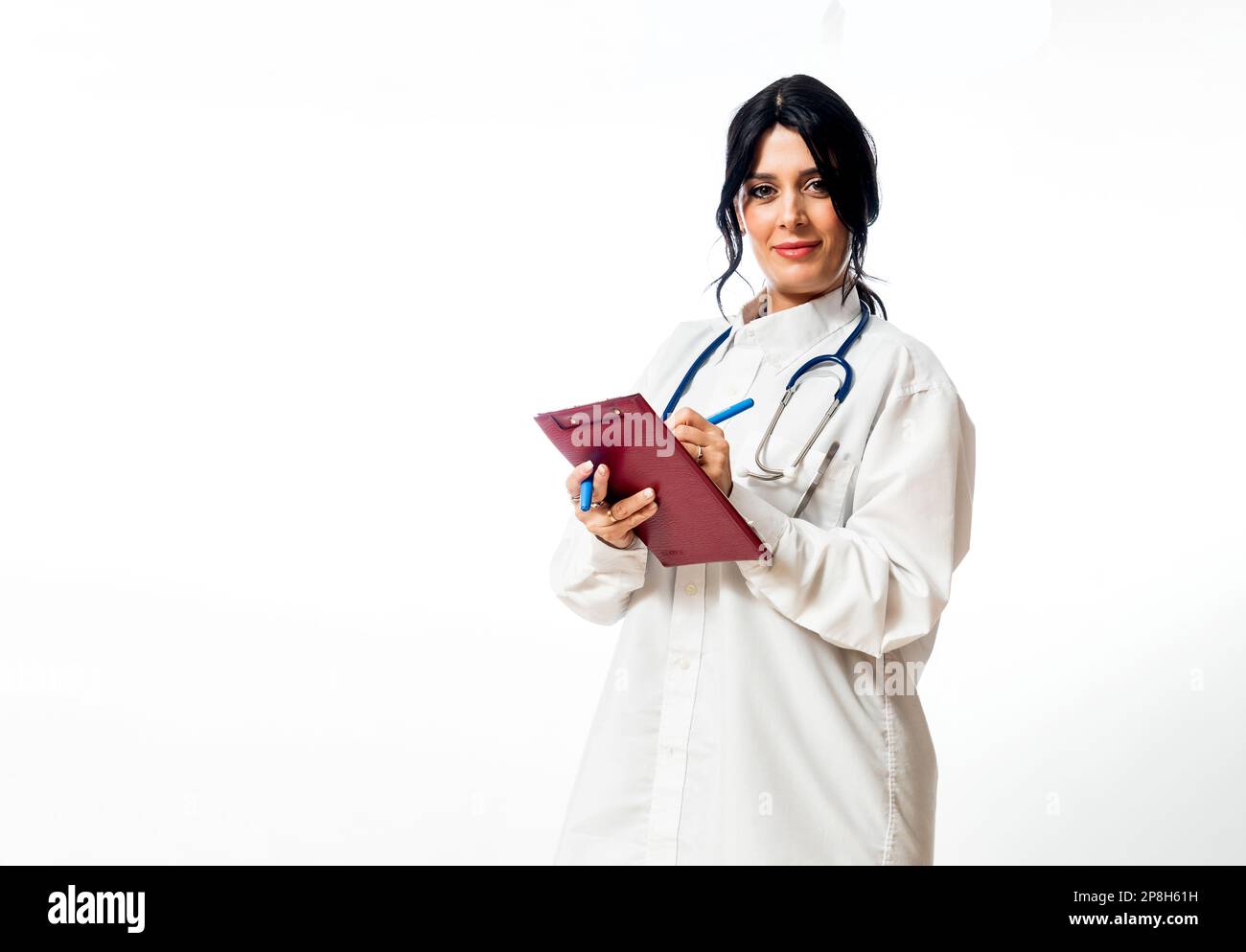 A Caucasian female doctor wearing a white lab coat and a stethoscope