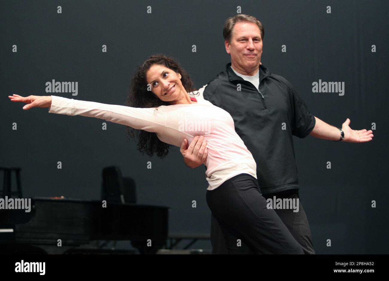 In this photo taken on Wednesday, April 29, 2009, Michigan State basketball  coach Tom Izzo, right, and his and wife Lupe rehearse in East Lansing,  Mich. Izzo will participate in a Broadway-style