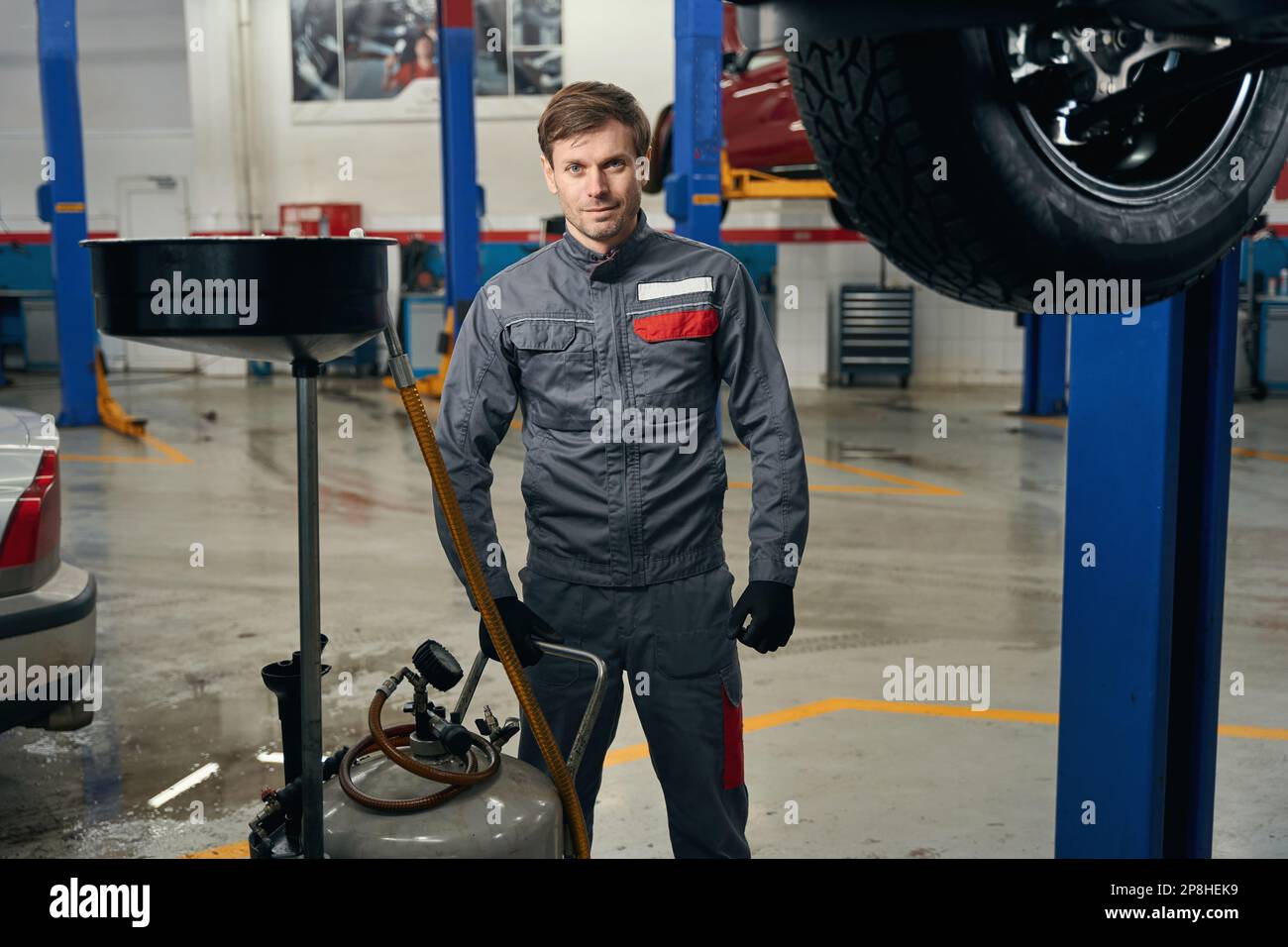Mechanic standing near car hi-res stock photography and images - Alamy