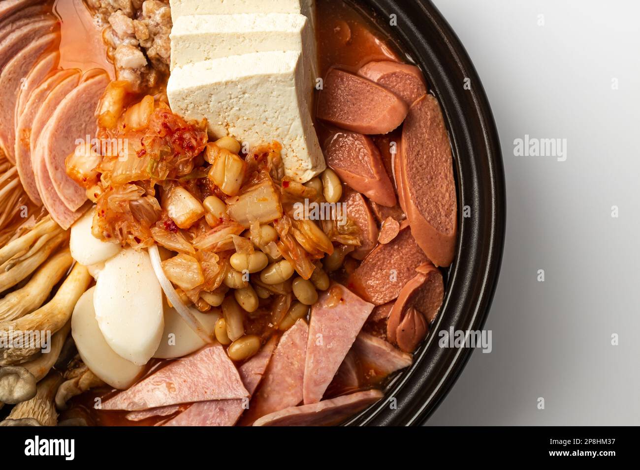 Korean food culture. Soup with ham and sausage. Korean Fusion Cuisine