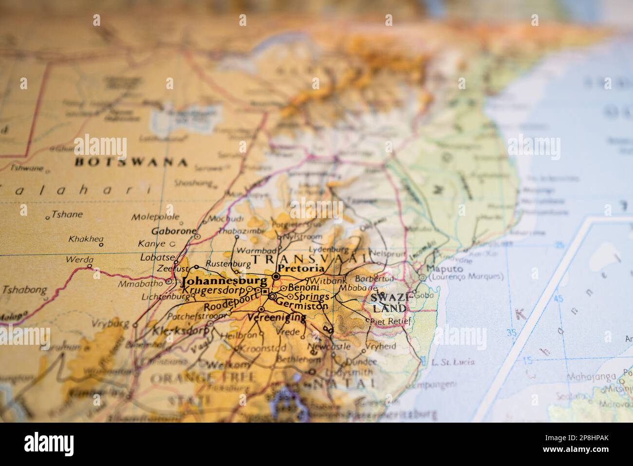 Shallow focus of the Johannesburg text seen on a generic, topographical map of South Africa. Stock Photo