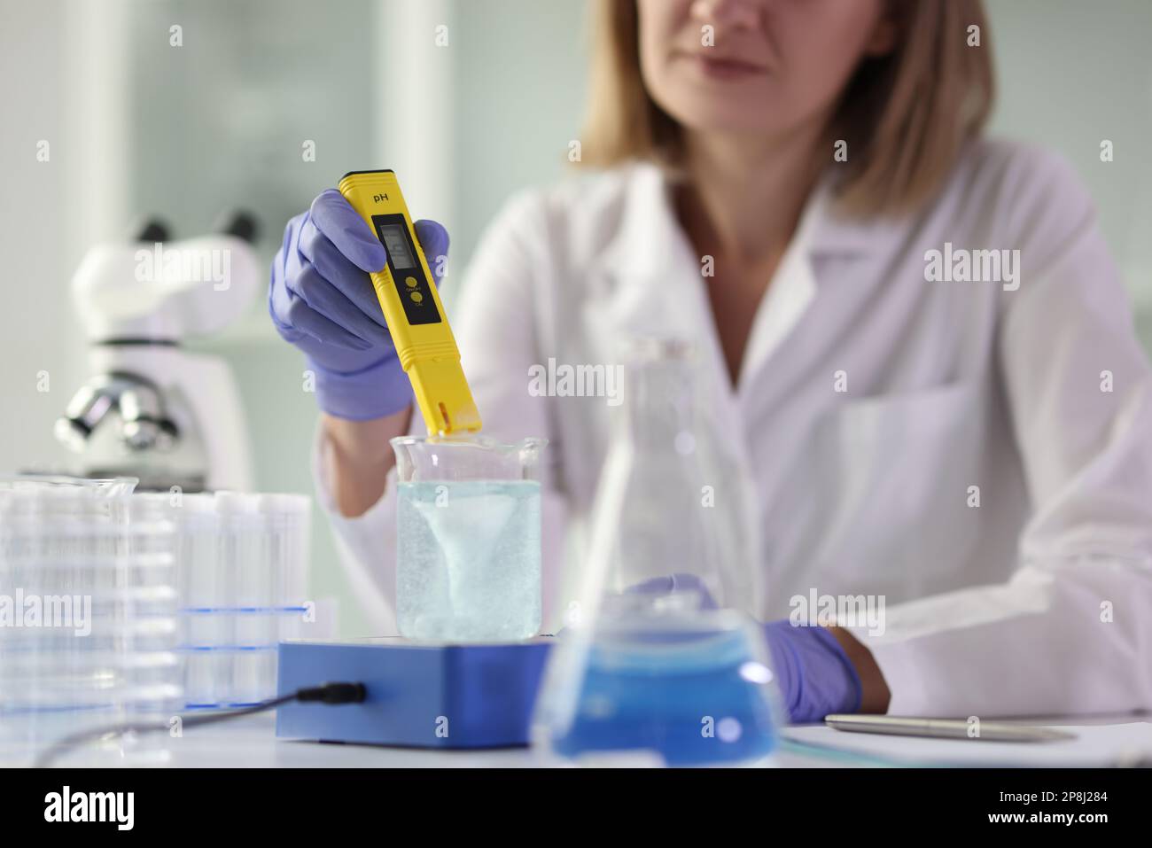 Female laboratory scientist conducts experiment hi-res stock ...