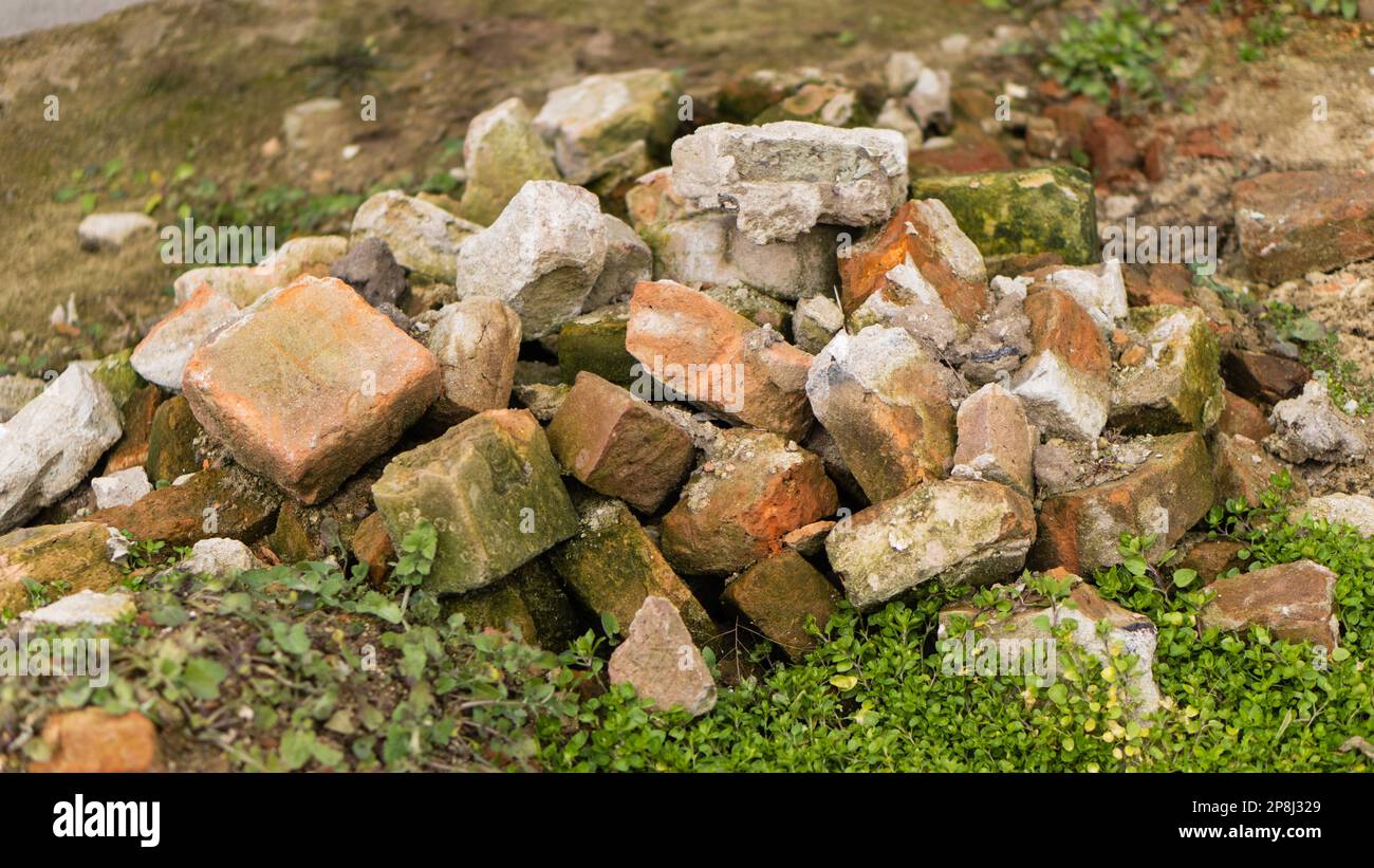 A pile of bricks in grass Stock Photo - Alamy