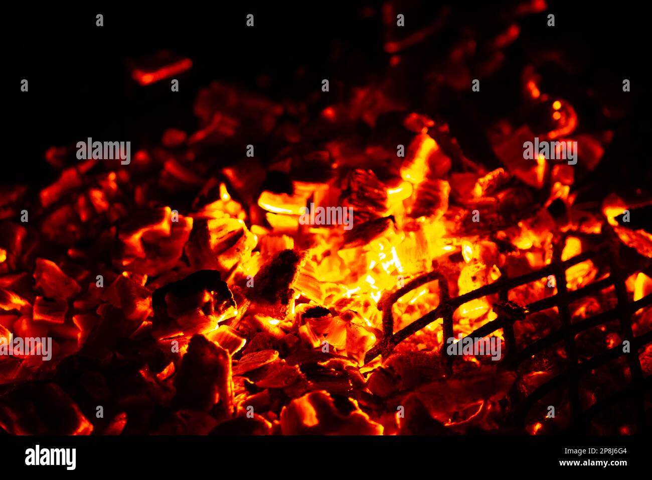Wood burns in an evening fire Stock Photo
