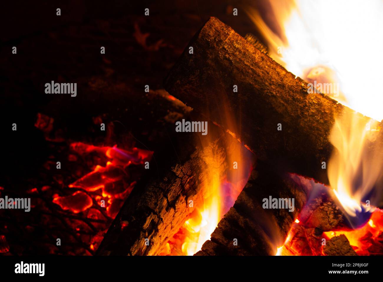 Wood burns in an evening fire Stock Photo Alamy