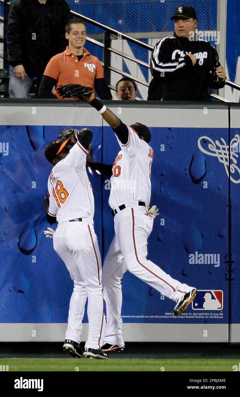 Baltimore Orioles left fielder Felix Pie (18) and center fielder Adam Jones,  right collide at the wall after Jones caught a ball hit by Chicago White  Sox's Jermaine Dye to end the