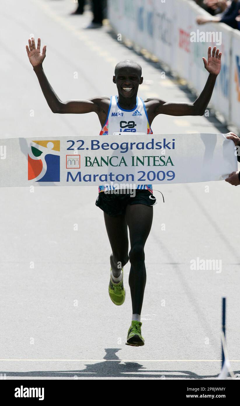 Kigen Victor Kiplagat of Kenya crosses the finish line to win the 22th international Belgrade Marathon race, Saturday, April 18, 2009, in Belgrade, Serbia. Kiplagat finished in 2 hours, 13 minutes and 28 seconds. (AP Photo/Darko Vojinovic) Stock Photo