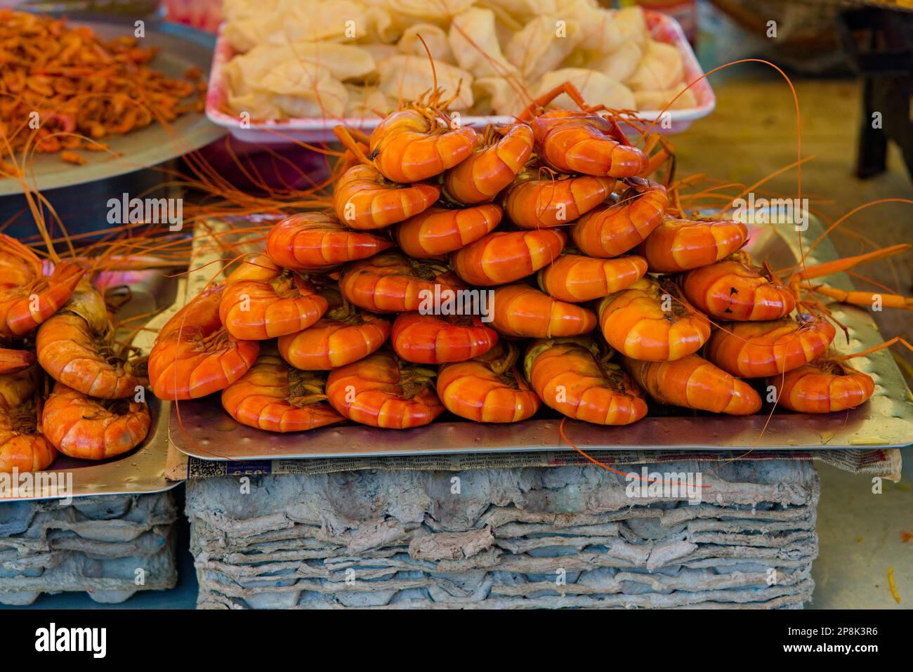 full plate of marinated prawns ready to be cooked in stall Stock Photo