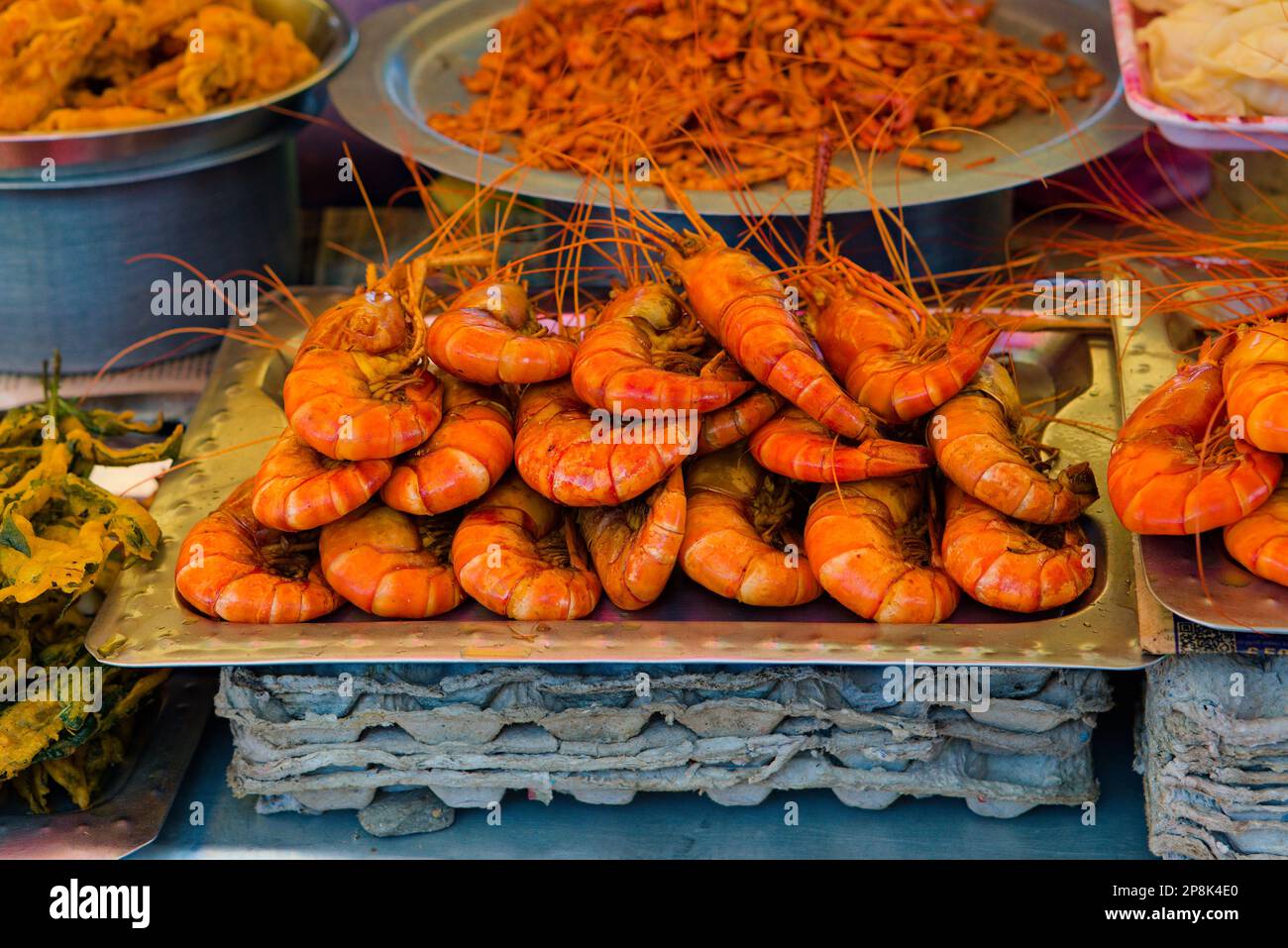 full plate of marinated prawns ready to be cooked in stall Stock Photo