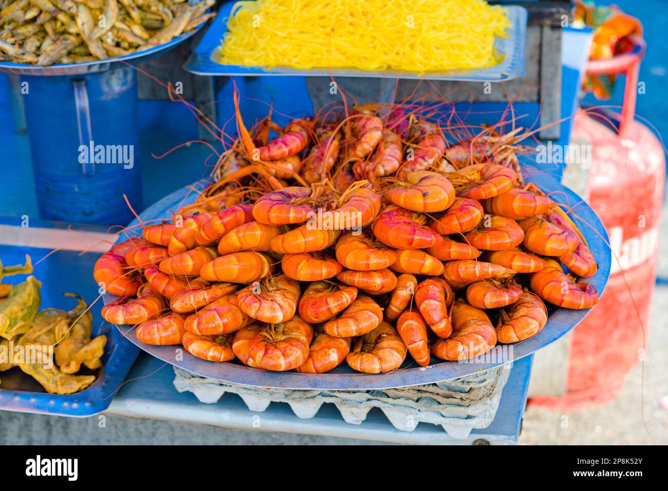 full plate of marinated prawns ready to be cooked in stall Stock Photo
