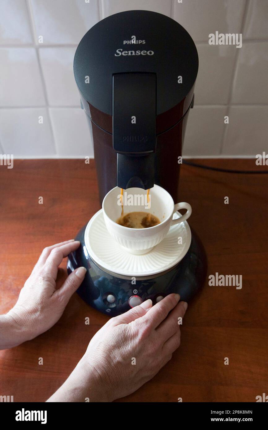 Tanja Meijers operates a Philips Senseo coffee machine in her kitchen in  Nieuw Vennep, Netherlands, Tuesday, April 14, 2009. Royal Philips  Electronics NV posted a first quarter net loss of euro59 million ($