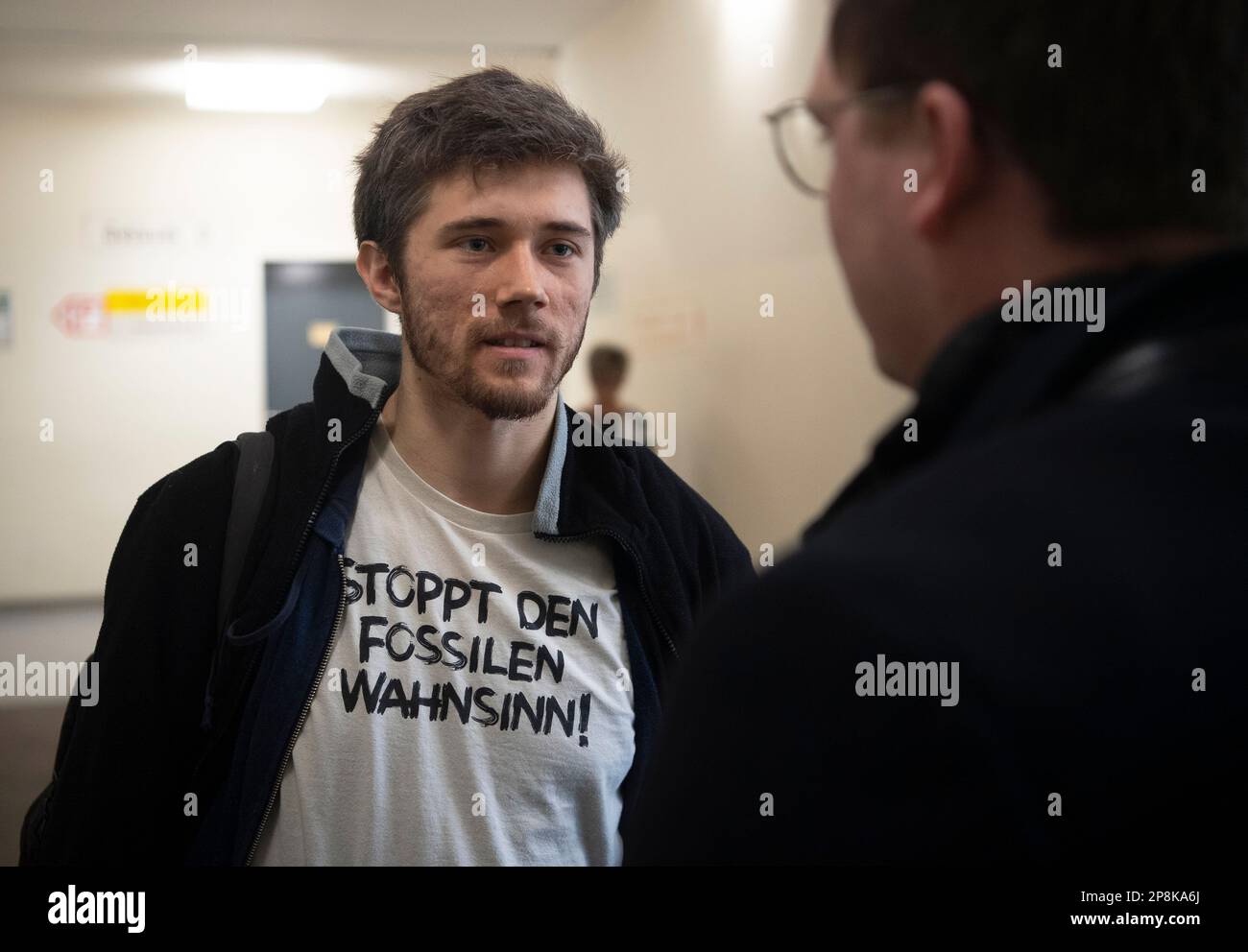 Berlin, Germany. 09th Mar, 2023. Henning Jeschke (l), activist of the climate protection group 'Last Generation', faces questions from a journalist after his trial. The trials of climate activists Jeschke and Hinrichs continue at the Berlin-Tiergarten District Court. Credit: Paul Zinken/dpa/Alamy Live News Stock Photo