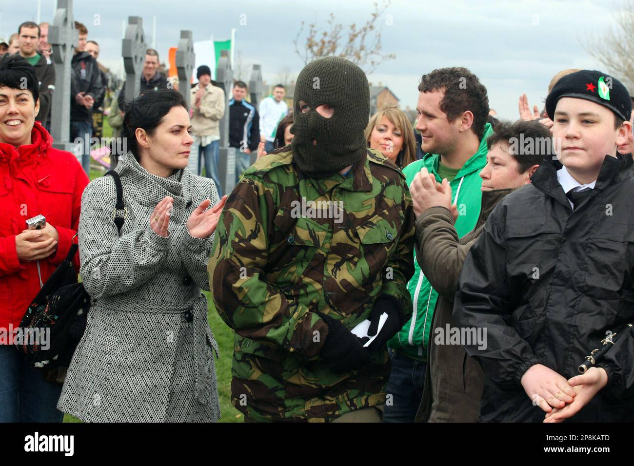 A Member Of The Real Irish Republican Army Rira Group Appears From The Crowd To Read Out A