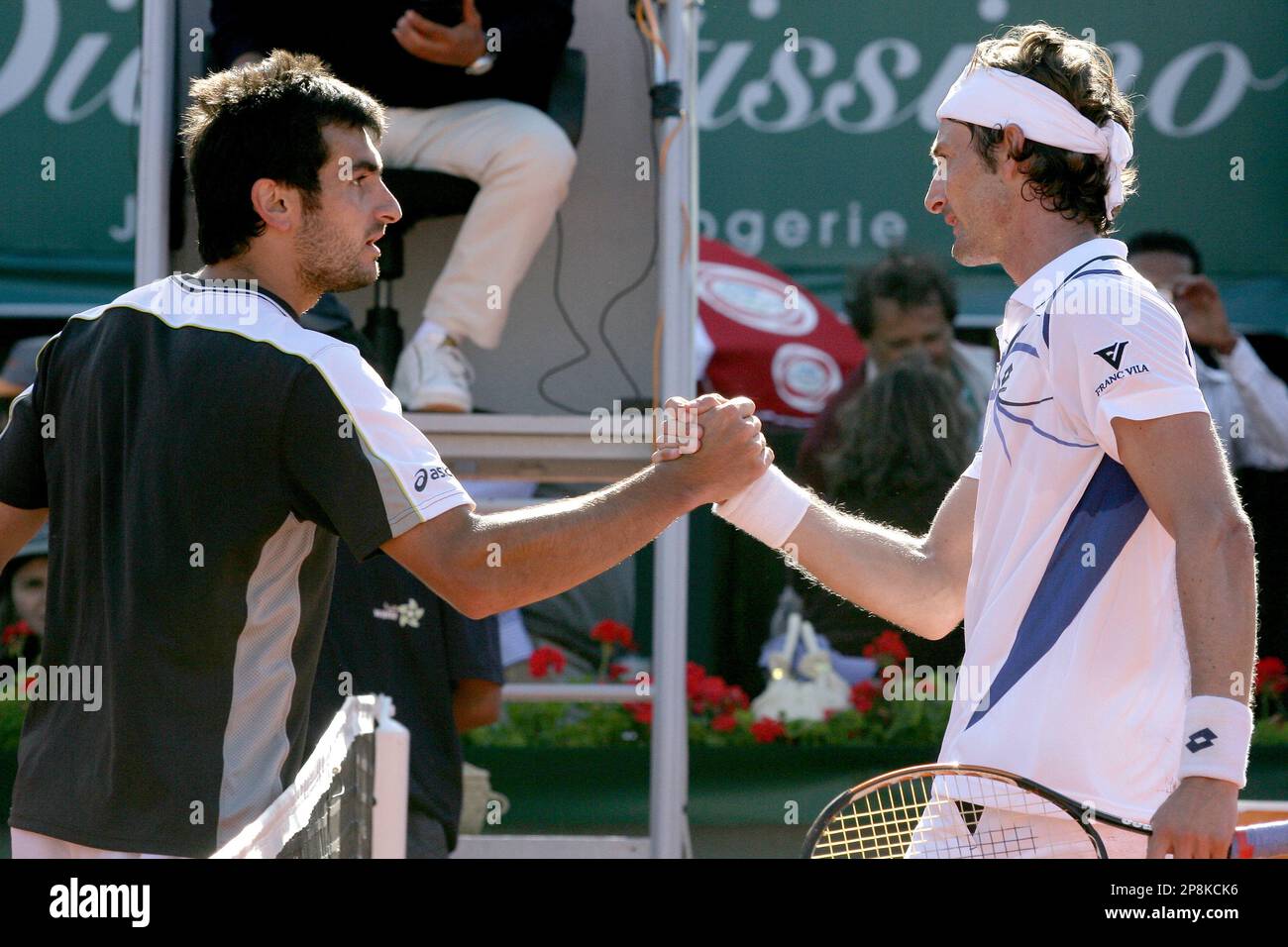Juan Carlos Ferrero from Spain (right) shakes hand Florent Serra from france (left) after the final of the Grand Prix Hassan II, a euro450,000 ATP Tour event on outdoor clay at Complexe