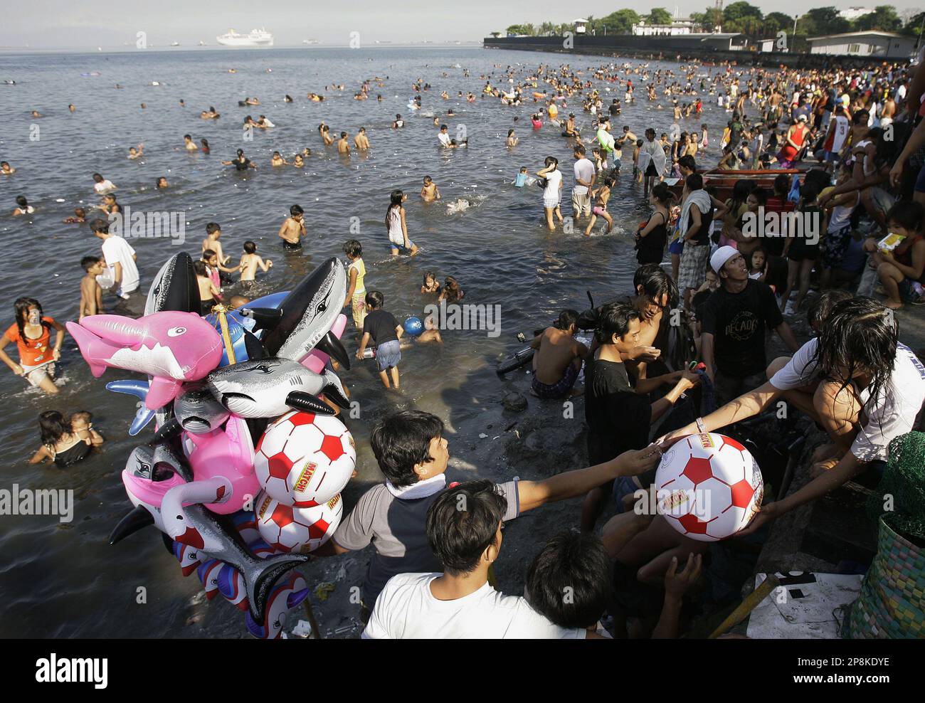 Poor Floating A woman buys a float as poor Filipinos frolic in the heavily polluted ...