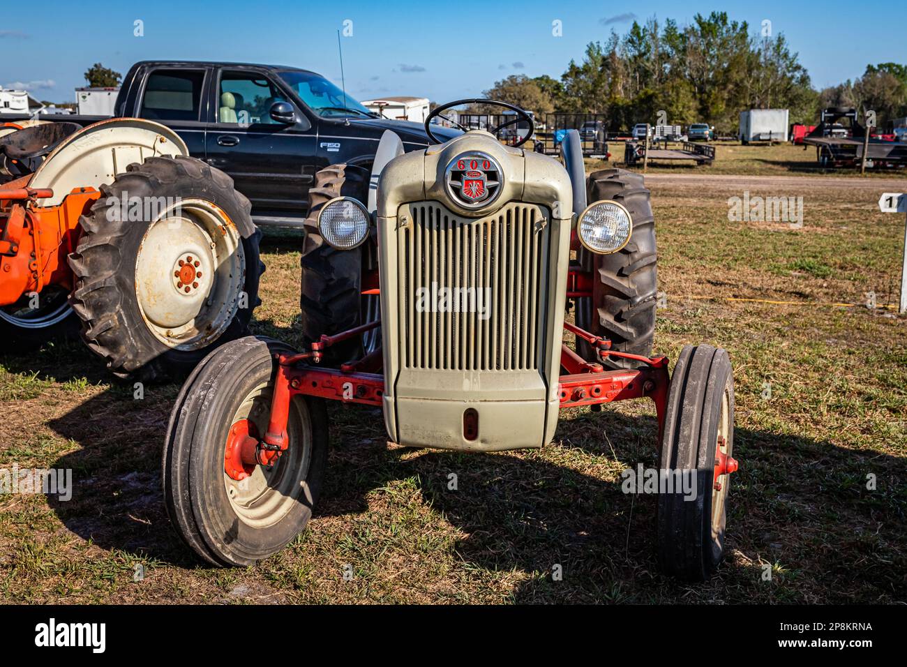 Fort Meade, FL - February 26, 2022: High perspective front view of a 1957 Ford Model 660 Tractor at a local tractor show. Stock Photo
