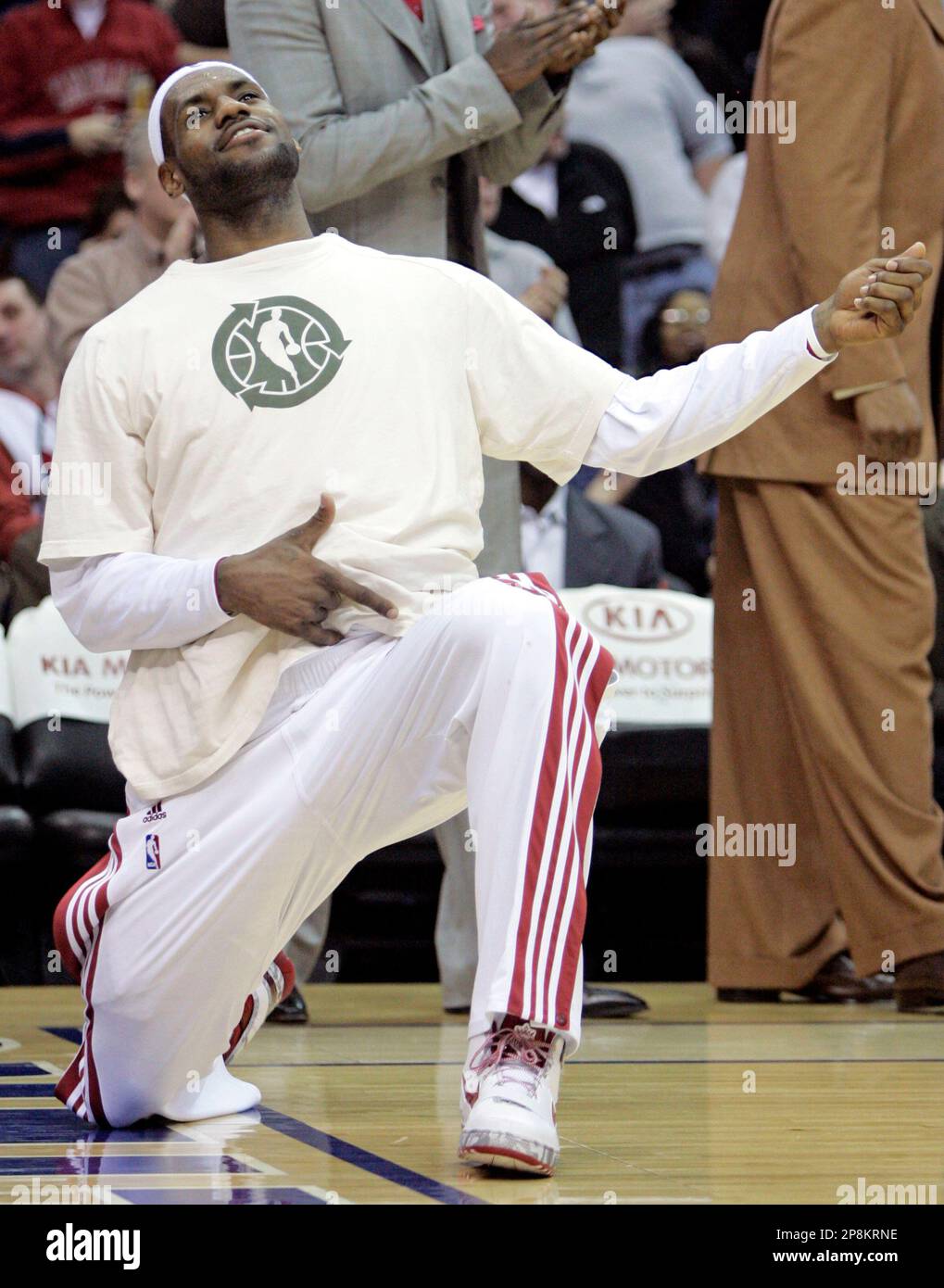 Cleveland Cavaliers' LeBron James plays air guitar in the