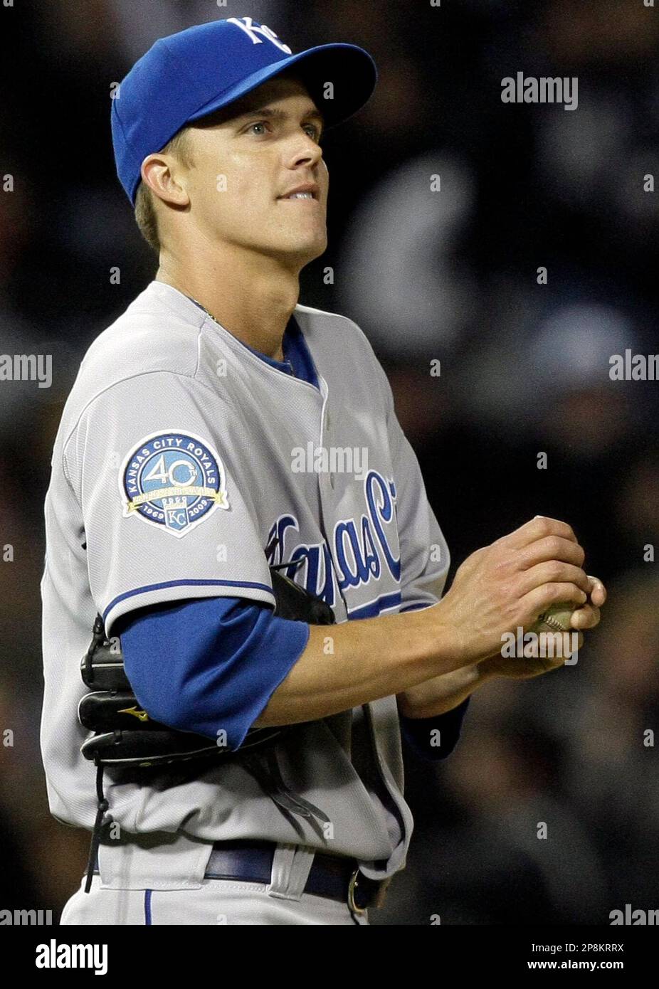 Kansas City Royals starting pitcher Zack Greinke smiles and looks at the  scoreboard after getting Chicago White Sox's Jim Thome to swing at a pitch  during the sixth inning of a baseball