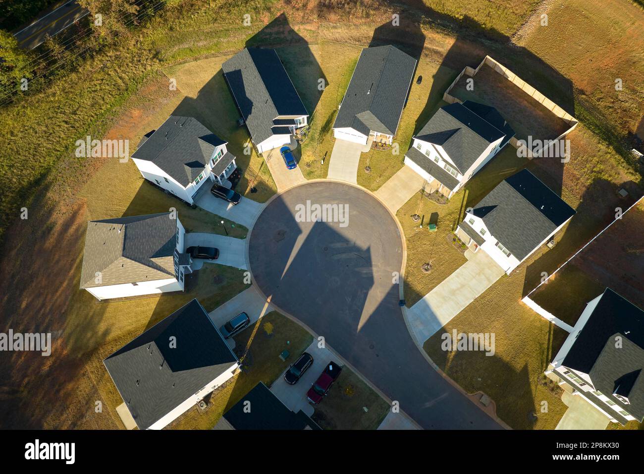 Aerial view of cul de sac at neighbourhood road dead end with densely built homes in South