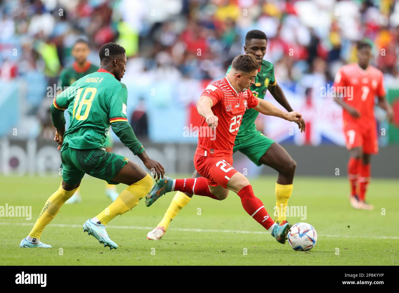 Martin Hongla (L), Collins Fai of Cameroon (R) and Xherdan Shaqiri of Switzerland (C) in action during the FIFA World Cup Qatar 2022 match between Switzerland and Cameroon at Al Janoub Stadium. Final score: Switzerland 1:0 Cameroon. (Photo by Grzegorz Wajda / SOPA Images/Sipa USA) Stock Photo