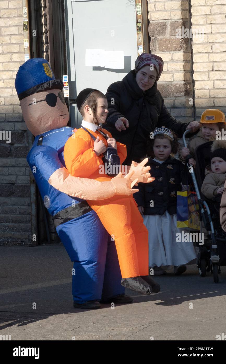 OPTICAL ILLUSION. A young hasidic Jewish boy in a clever Purim costume ...