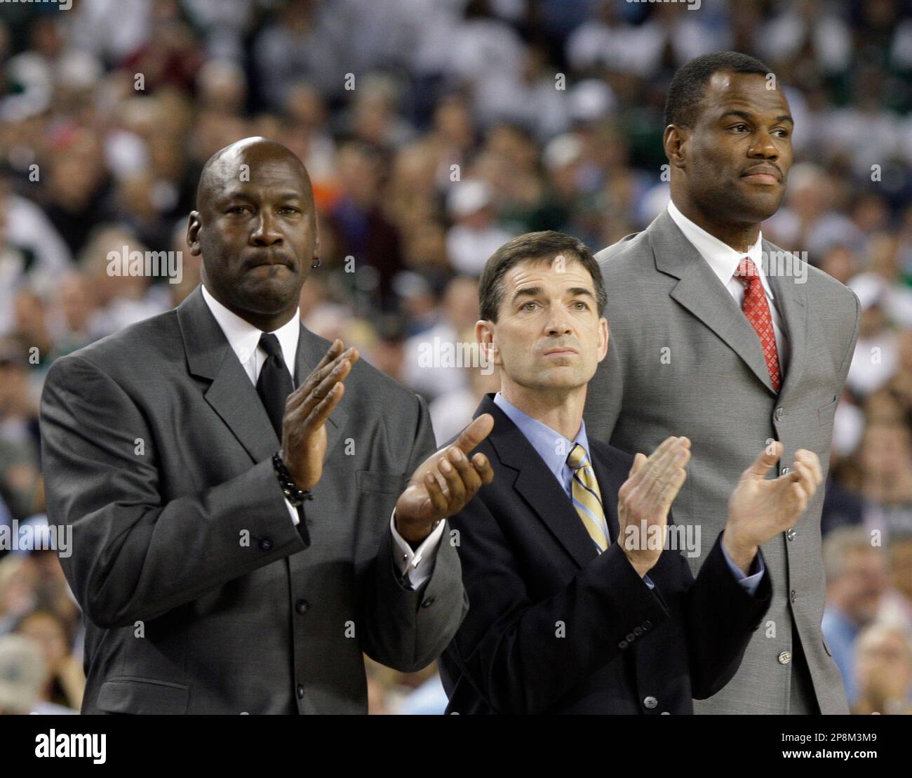 Former NBA basketball players David Robinson, Michael Jordan, John Stockton  and Rutgers women's coach C. Vivian Stringer, left to right, are honored at  halftime of the NCAA Final Four championship basketball game