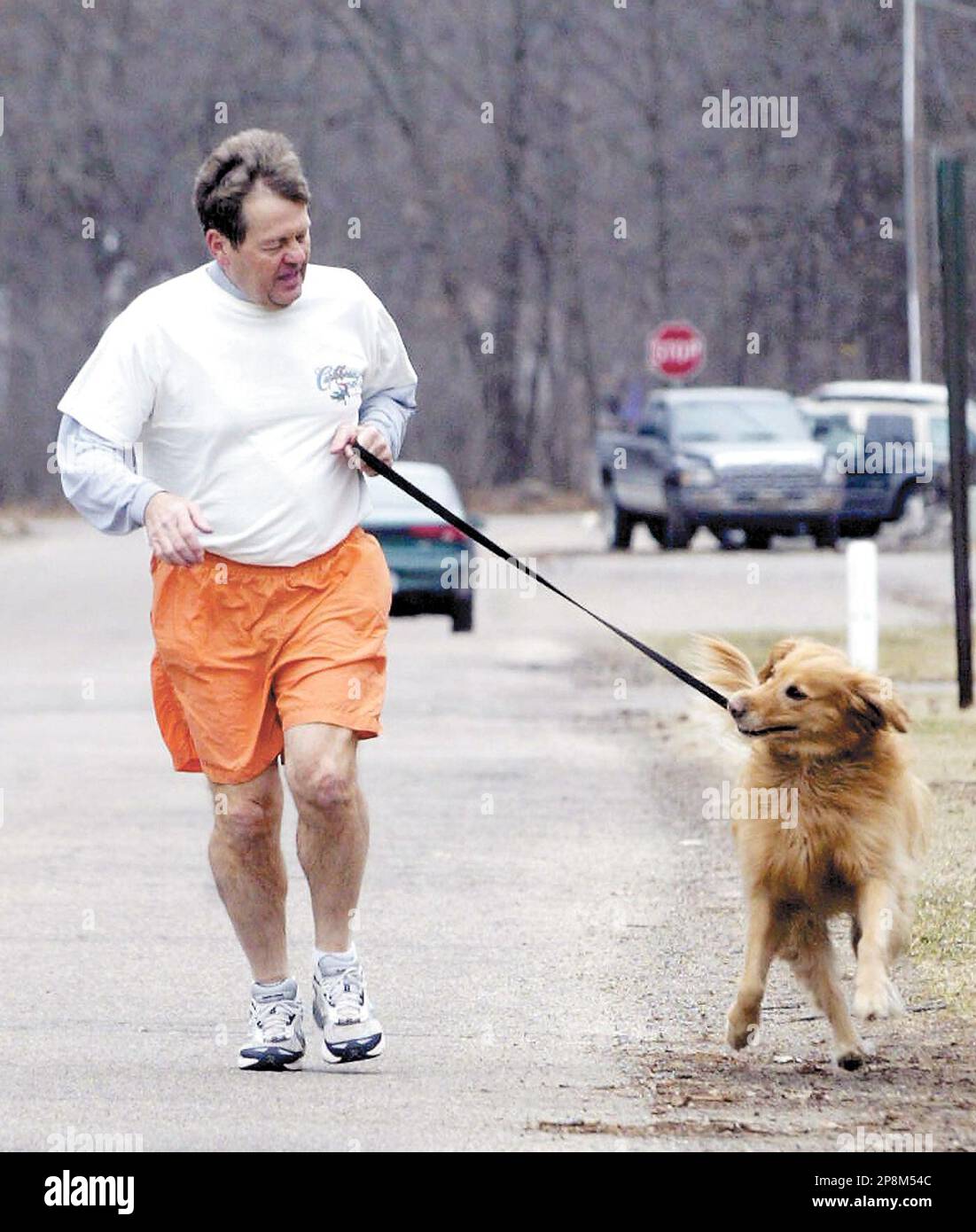 Kim Halladay's running partner, his golden retriever Polly, is peppy in the  beginning of their daily run, but slows down on the way to his Ludington,  Mich.,home. Halladay recently reached a milestone.