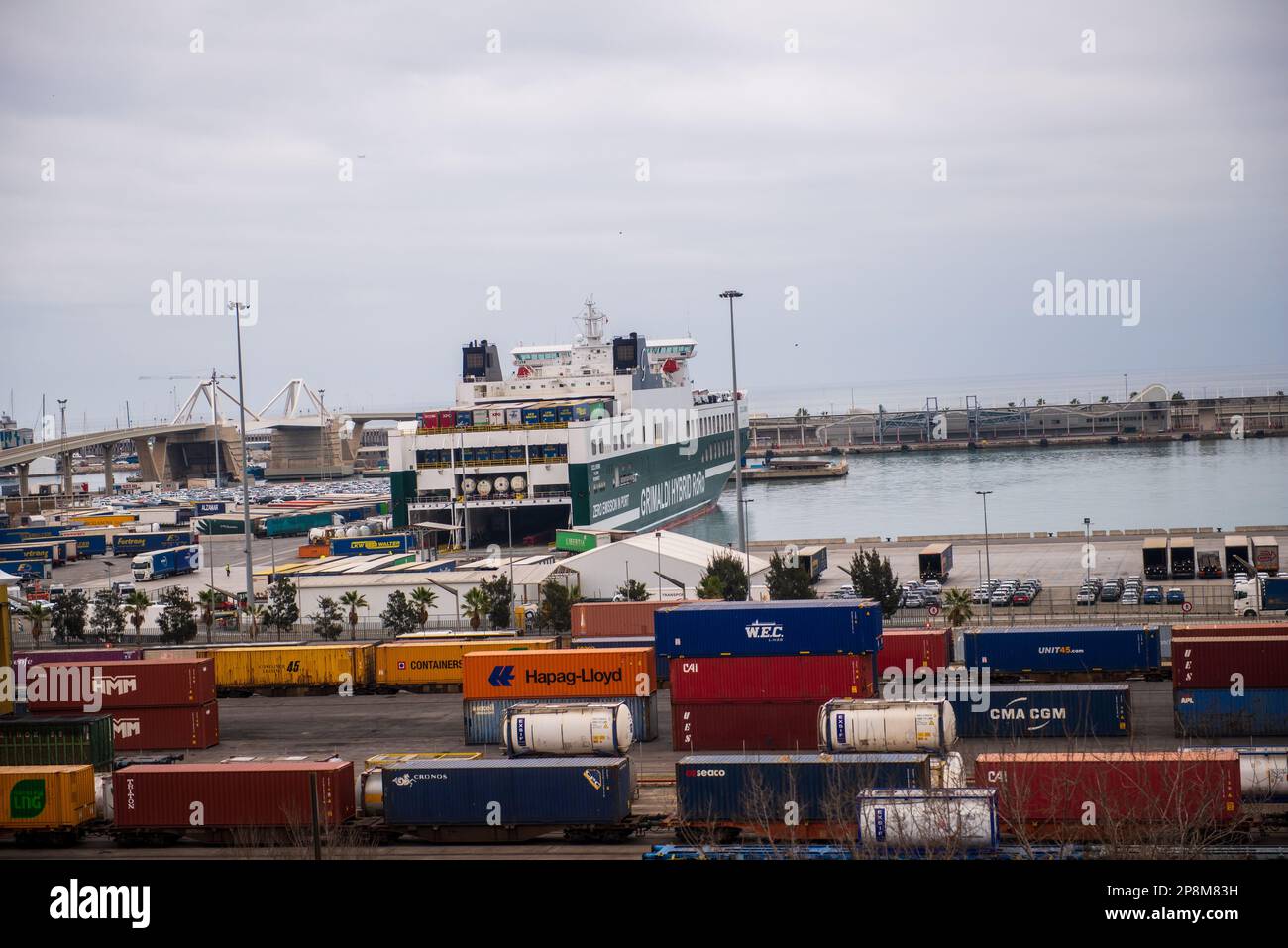 A Ro-Ro freighter is moored in Barcelona port next to a railroad freight terminal Stock Photo