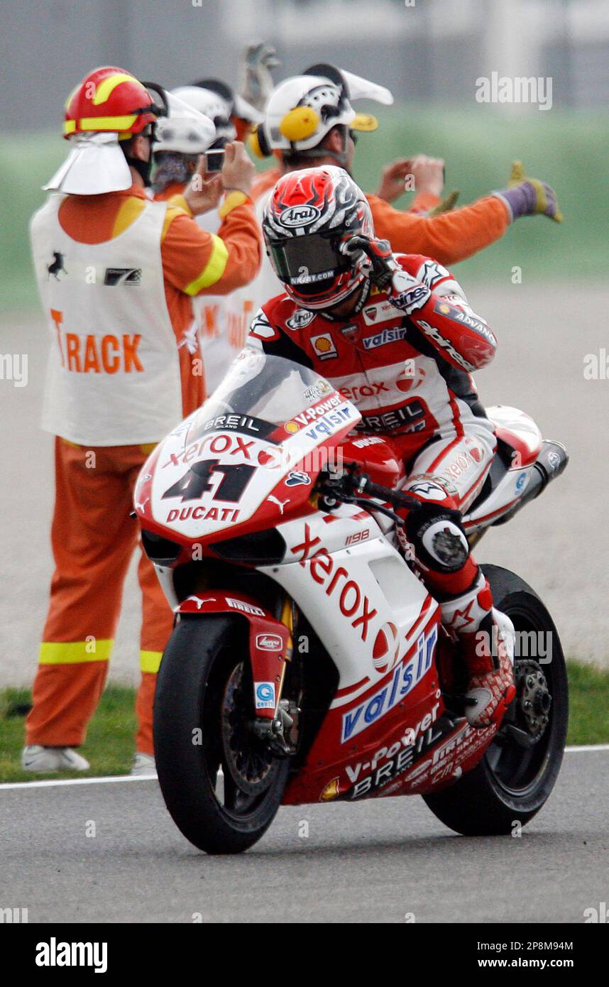 Japanese rider Noriyuki Haga of Ducati Xerox Team reacts after