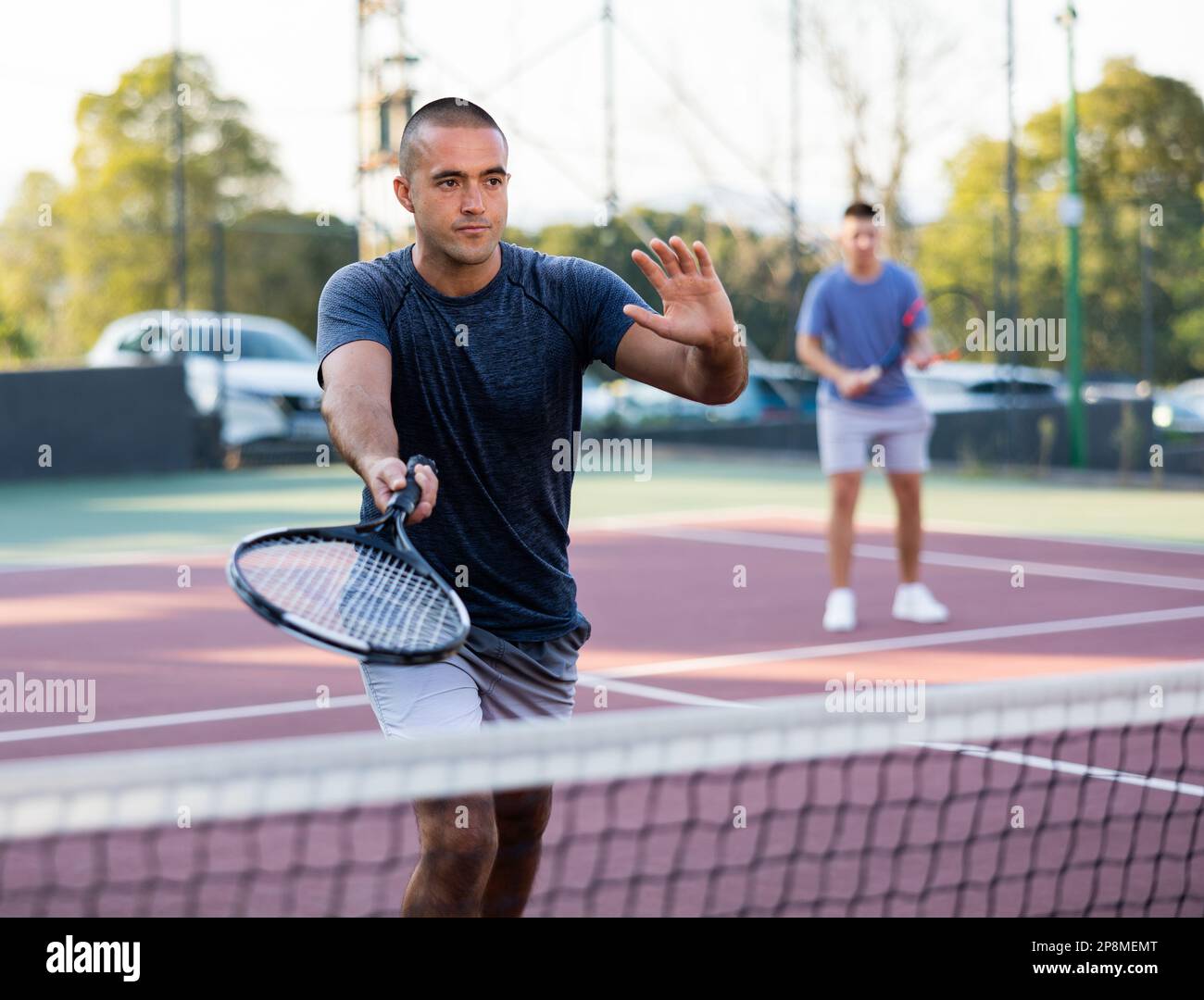 Male tennis player training on court Stock Photo Alamy