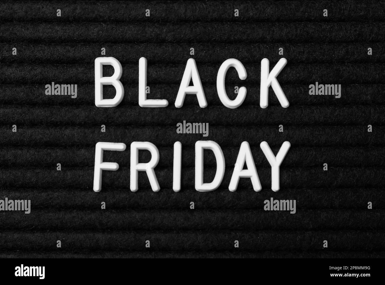 Words Black Friday on dark fabric, flat lay Stock Photo